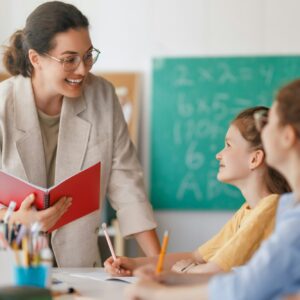 Happy kids and teacher at school